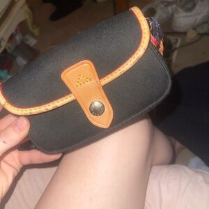 Dooney & Bourke Black Canvas Pouch with Tan Trim and Red Accent